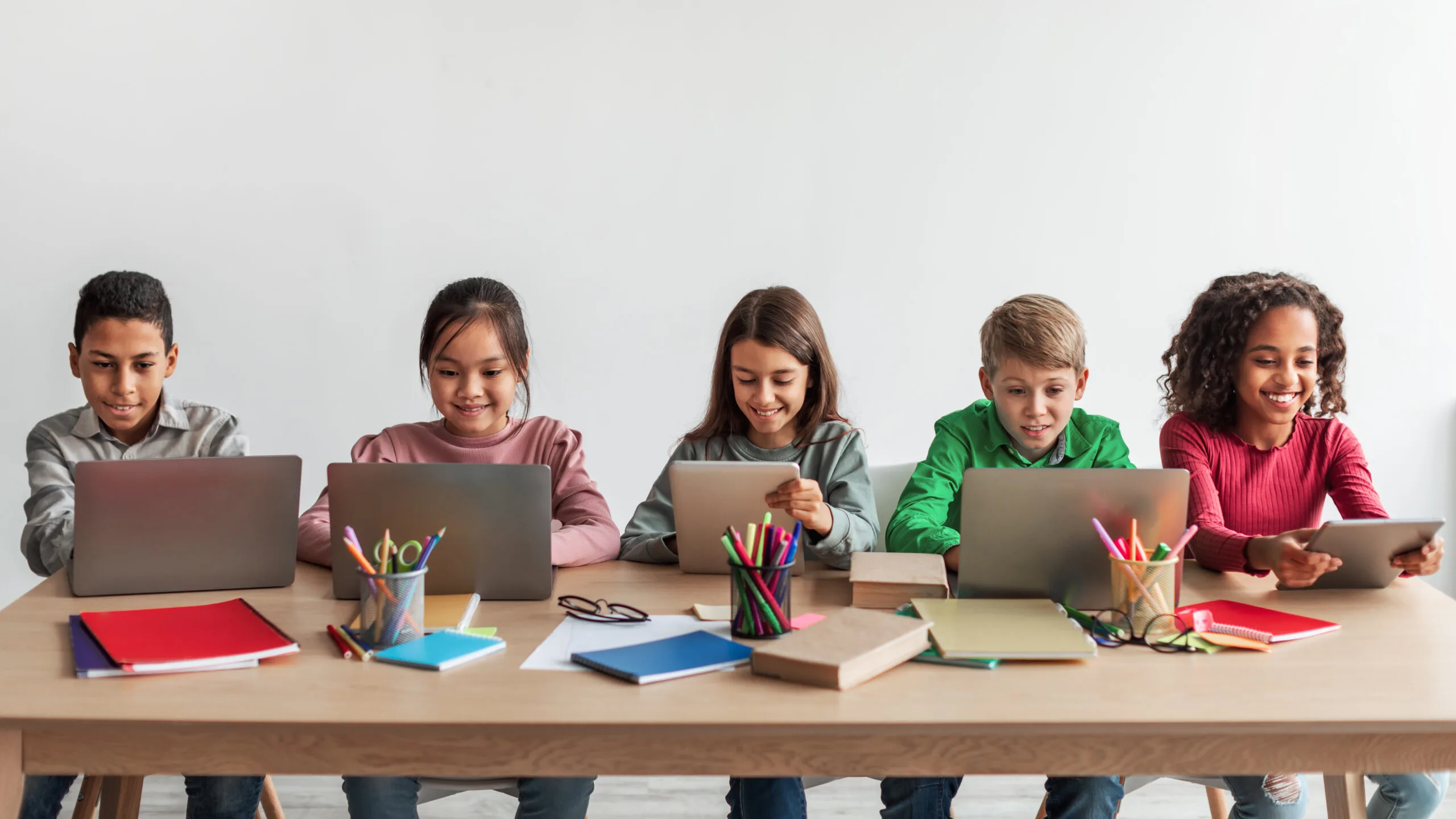 Group of students using laptops for learning
