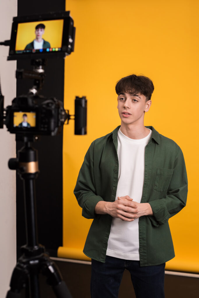 Content creator filming a video with professional lighting and camera equipment, showcasing alternative career paths beyond the traditional roles and encouraging to stop forcing kids to be doctors or engineers.