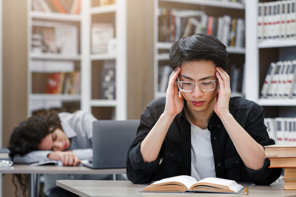 Students sitting stressed in a classroom, illustrating the pressure children face when parents stop forcing kids to be doctors or engineers.