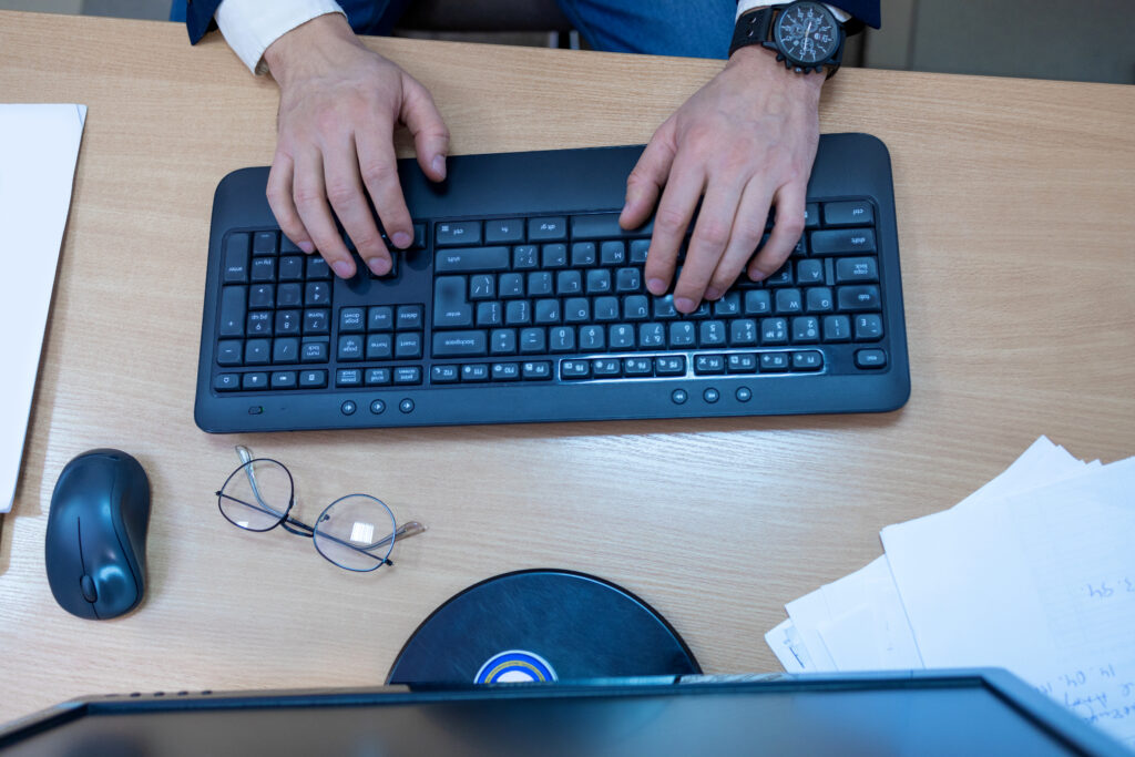 Person working from home completing microtasks on laptop.