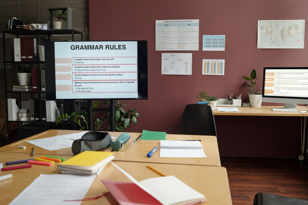 Office notice boards displayed with grammar rules showing the traditional way of how to learn English