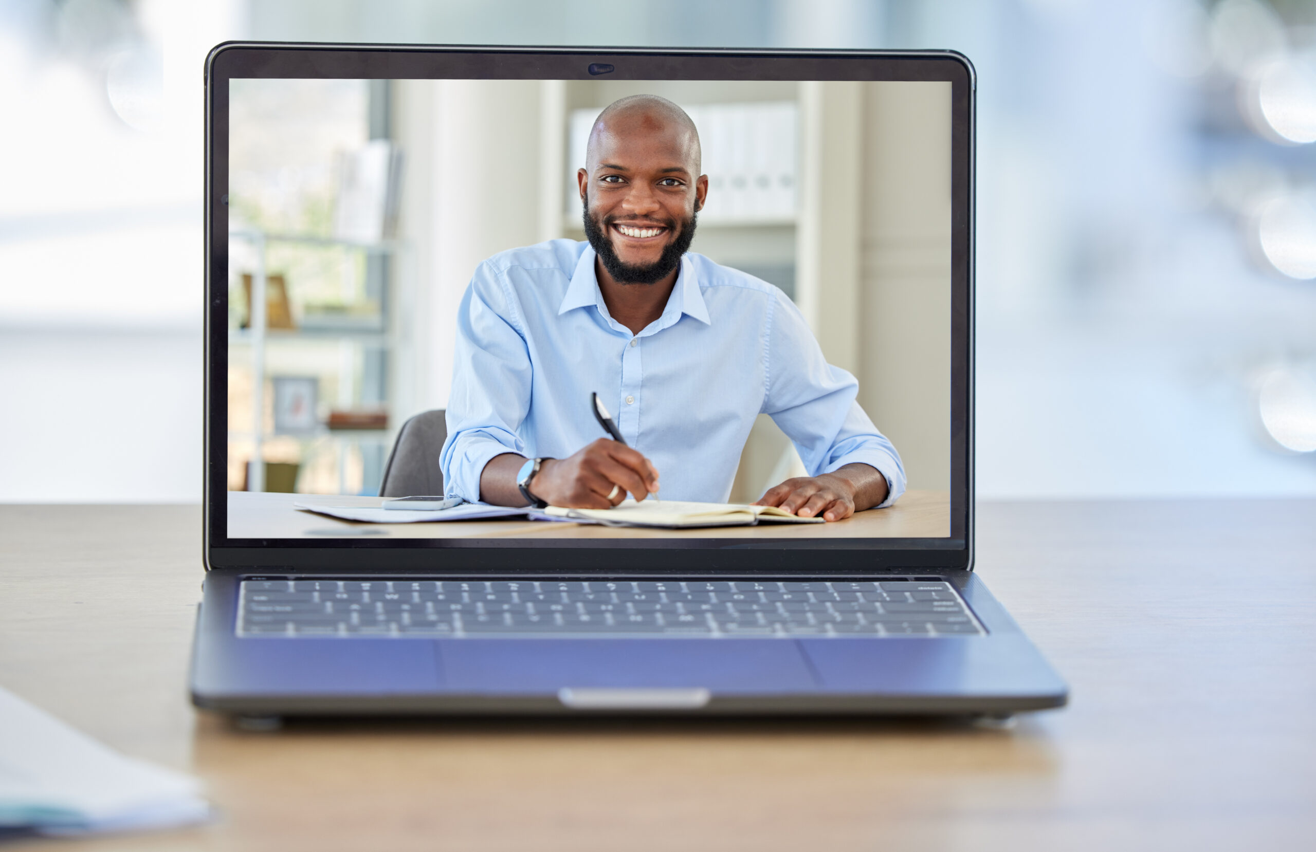 Online tutor teaching students from home on laptop.