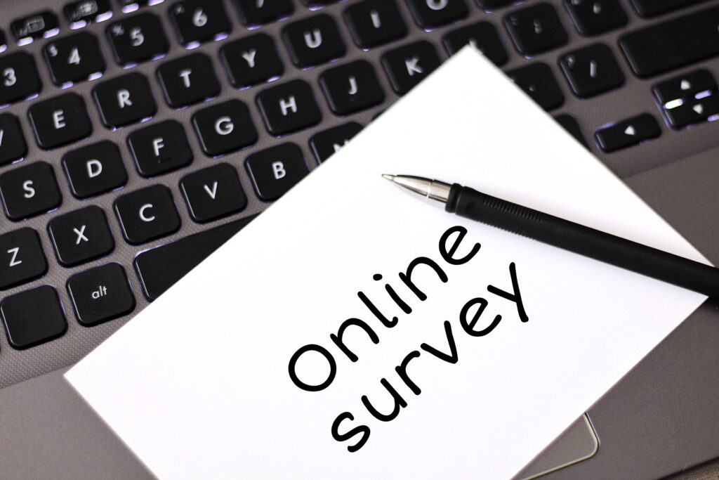 Person taking online surveys from home on laptop.