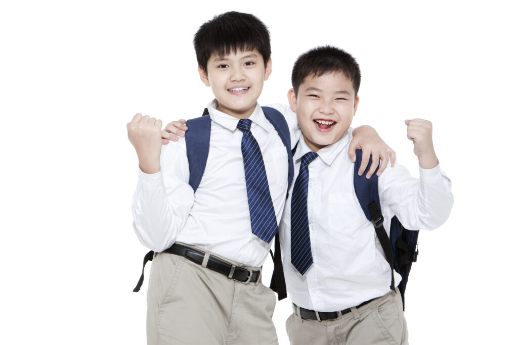 Two boys with school bags in Saudi Arabia