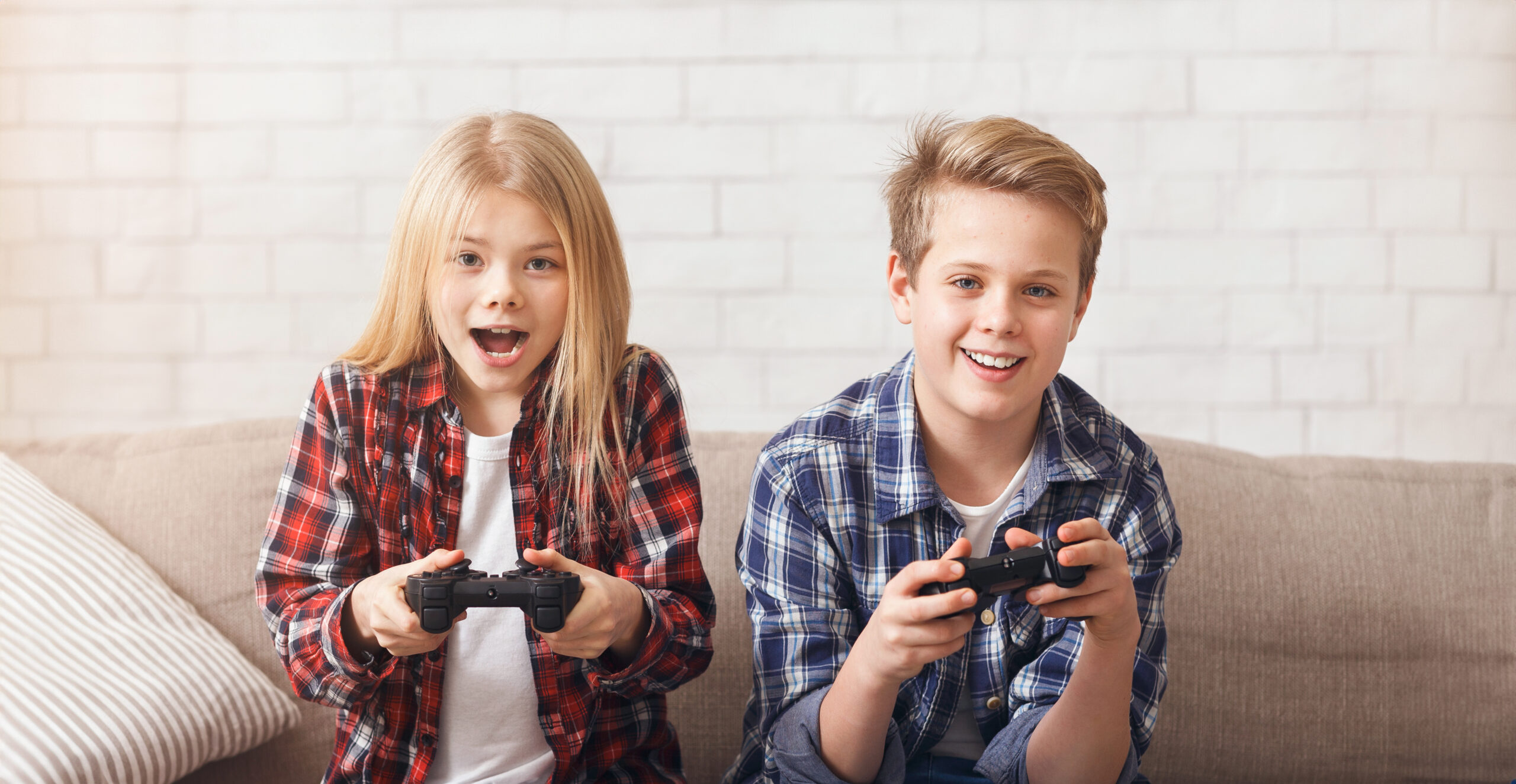 Child playing video games indoors, highlighting screen time and its effects on healthy childhood habits.