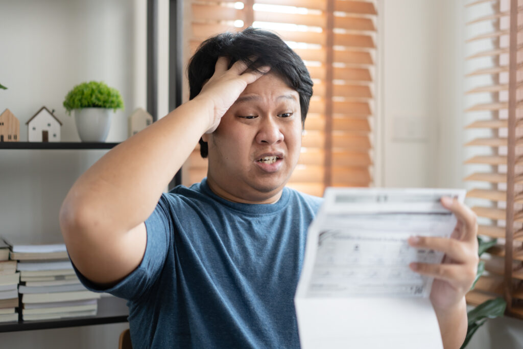 Stressed person worried about bills, reminded of death and life’s fragility
