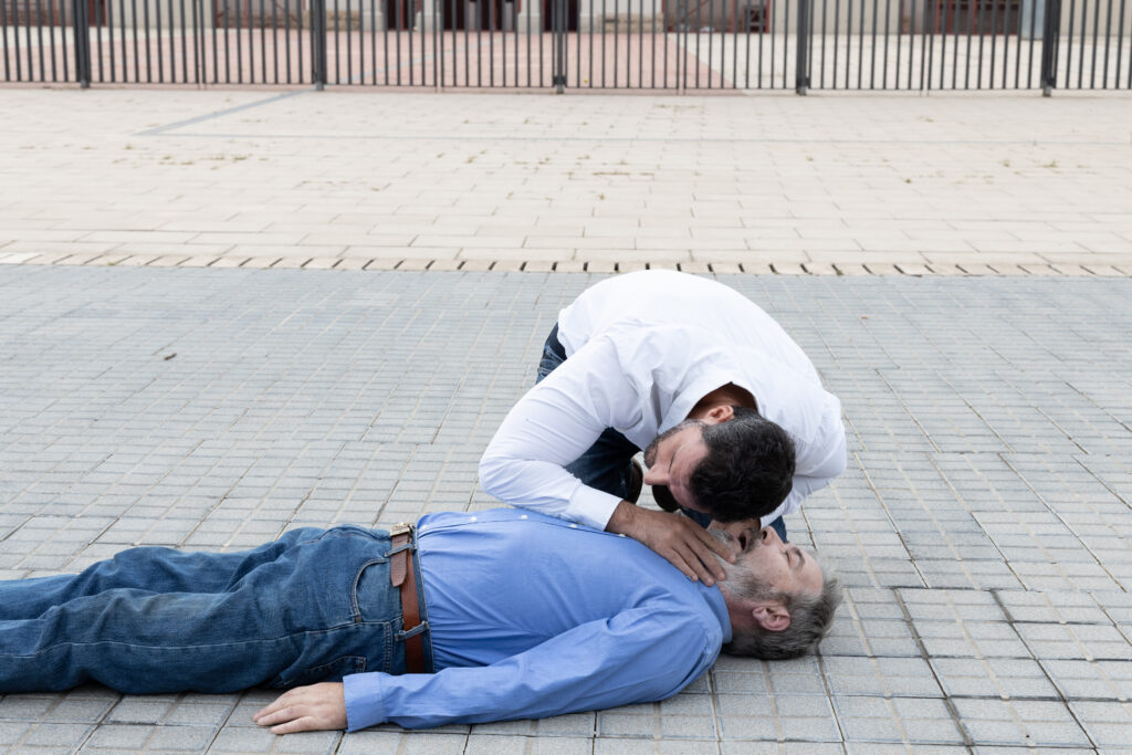 Man lying dead while his son cries, showing the harsh truth that money cannot stop death