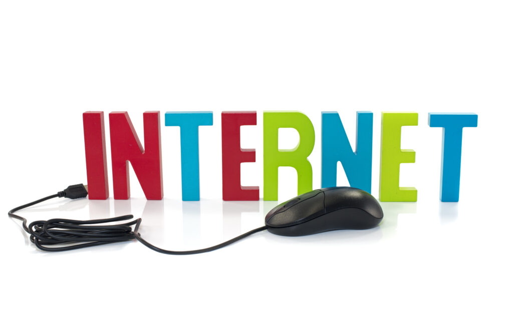 Mouse pointing at the word Internet on a screen, representing early web technology.