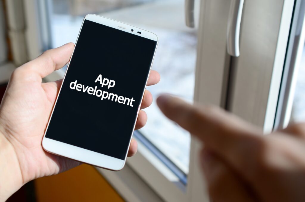Mobile phone screen displaying App Development, representing mobile app creation.