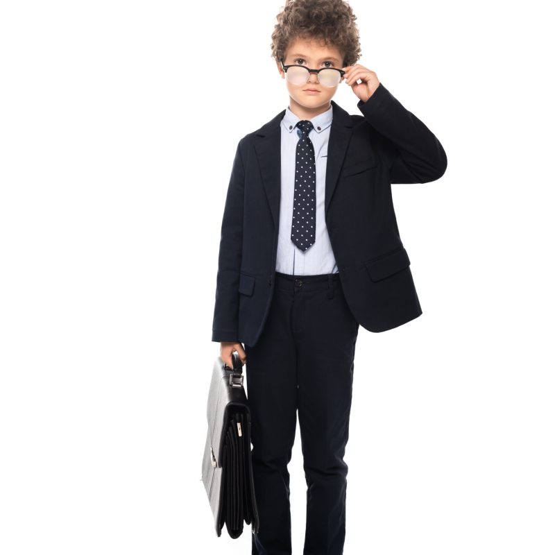 Kid dressed formally holding a briefcase-style bag